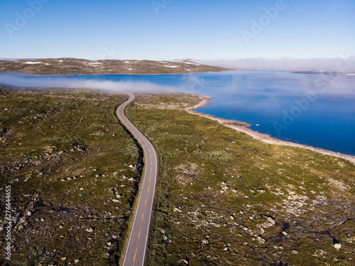 Road crossing Hardangervidda plateau, Norway. Aerial view. photo