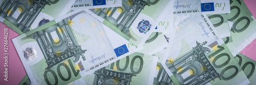 Euro cash on a lilac, purple and pink background. Euro Money Banknotes. Euro Money. Euro bill. Place for text.