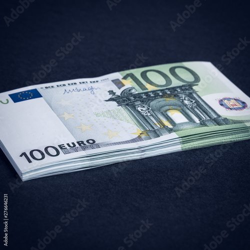 Euro cash on a pink and black background. Euro Money Banknotes. Euro Money. Euro bill. Place for text. photo