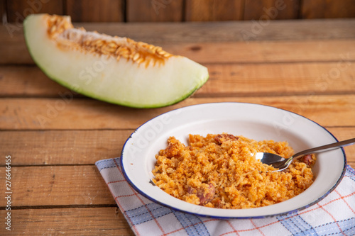 Las migas is a typical Spanish dish made with crumbs, onions and chorizo photo