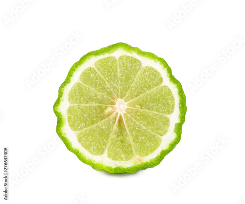 A half of bergamot or kaffir with seeds isolated on white background