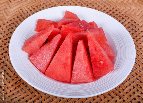 Sliced watermelon on a wooden background