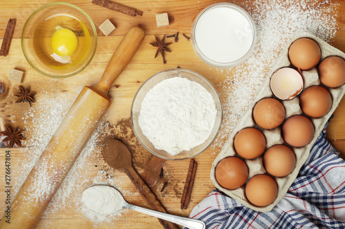 Food ingredients for baking: flour, eggs, milk, sugar 