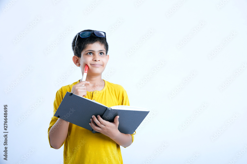Young indian cute boy with notebook Young indian cute boy with notebook
