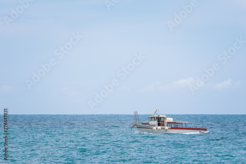 Fototapeta Naklejka Na Ścianę i Meble -  Boat on the Tyrrhenian Sea seen from the Minori and Maiori Beach, Amalfi Coast, Campania, Italy