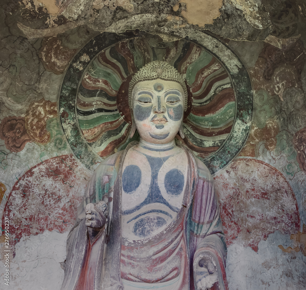Sculpture of Buddha in a niche of a grotto at Mount Maiji or Maijishan Grottoes, Tianshui, Gansu, China. Constructed from late fourth century CE. National heritage.