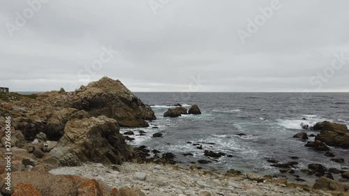 Dramatic coastal cliffs, rainy day, pacific ocean photo