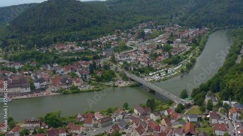Aerial view of Neckargemünd beside the Neckar river in Germany. Pan to the left across the old part of town. photo