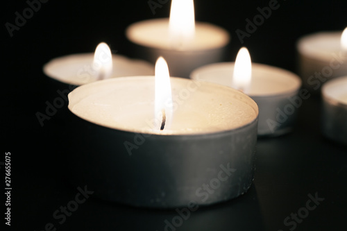 Candles Burning at Night. White Candles Burning in the Dark