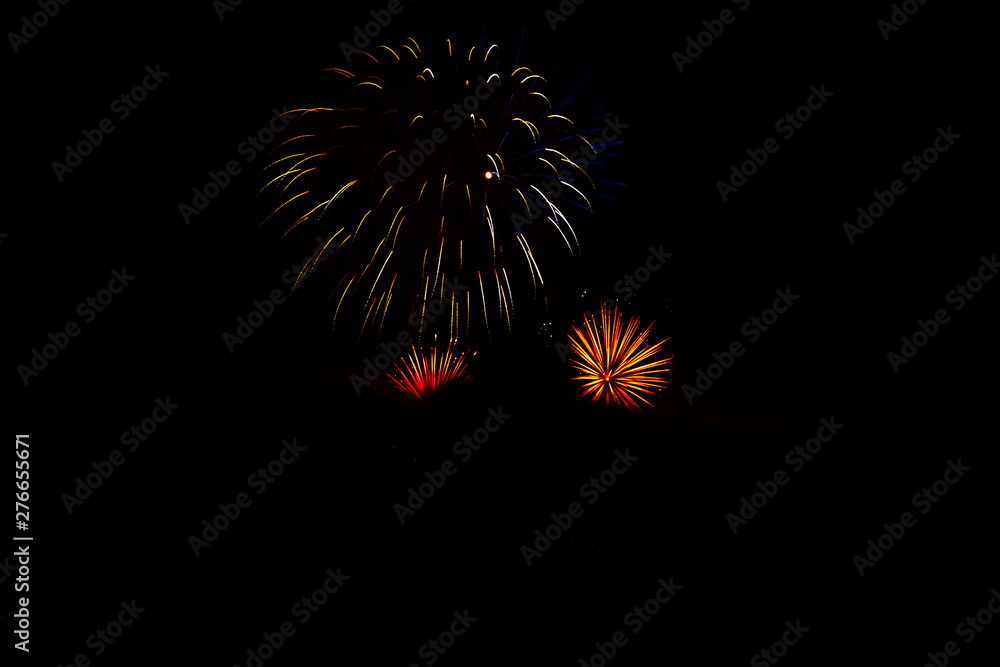Awesome isolated Festive fireworks on a dark background. Can be used as wallpaper or background Awesome isolated Festive fireworks on a dark background. Can be used as wallpaper or background