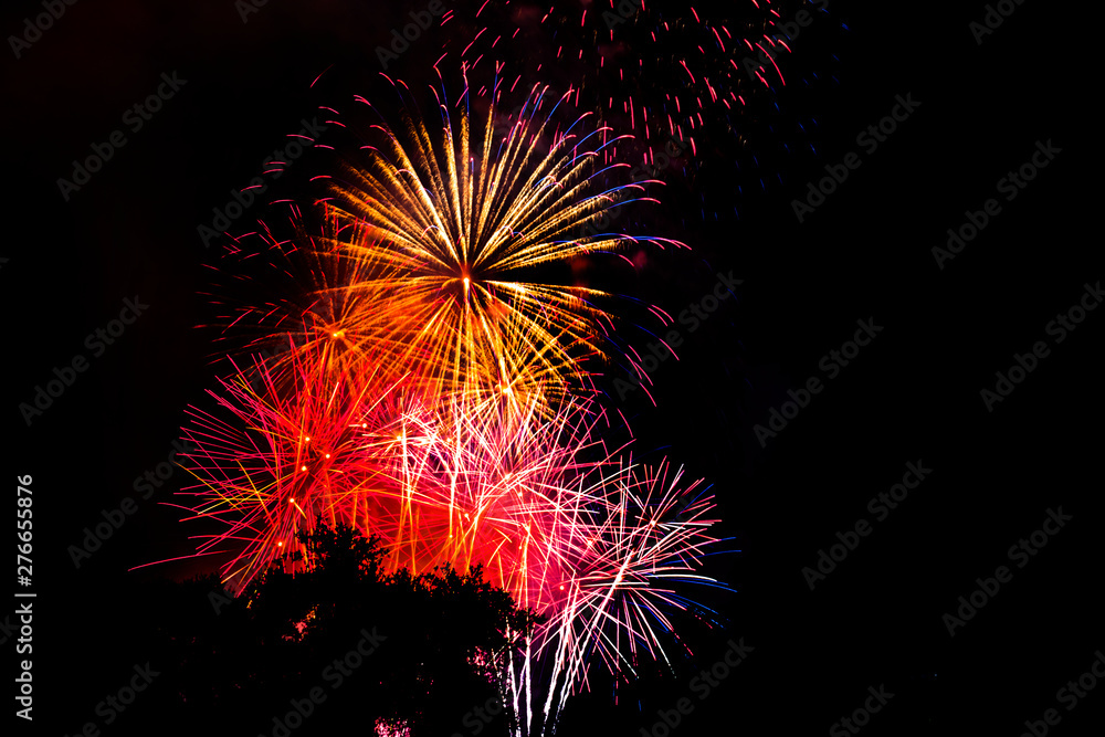 Awesome isolated Festive fireworks on a dark background. Can be used as wallpaper or background