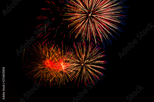 Awesome isolated Festive fireworks on a dark background. Can be used as wallpaper or background