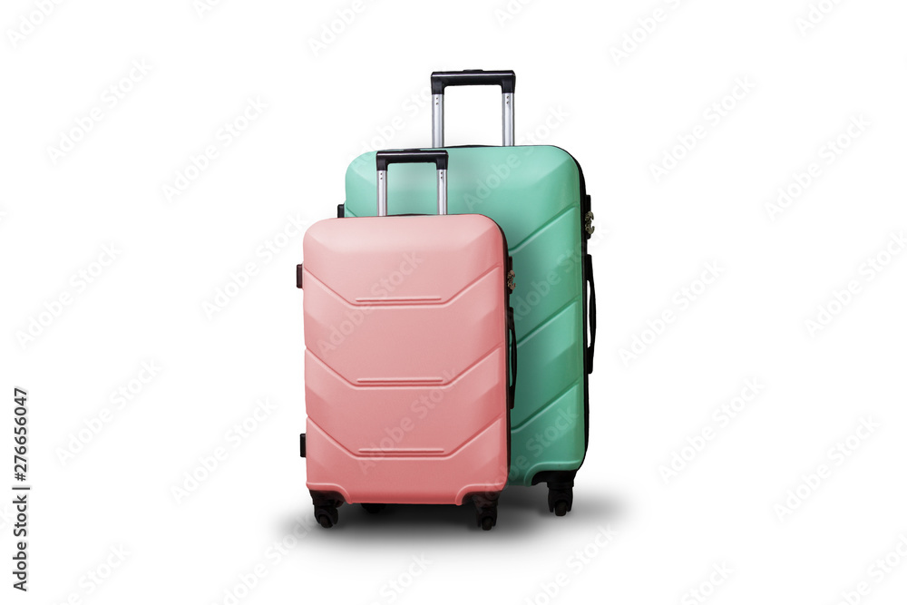 Two Suitcases on wheels on a white isolated background. Сoncept of travel, a vacation trip, a visit to relatives. Pink and Green color Two Suitcases on wheels on a white isolated background. Сoncept of travel, a vacation trip, a visit to relatives. Pink and Green color