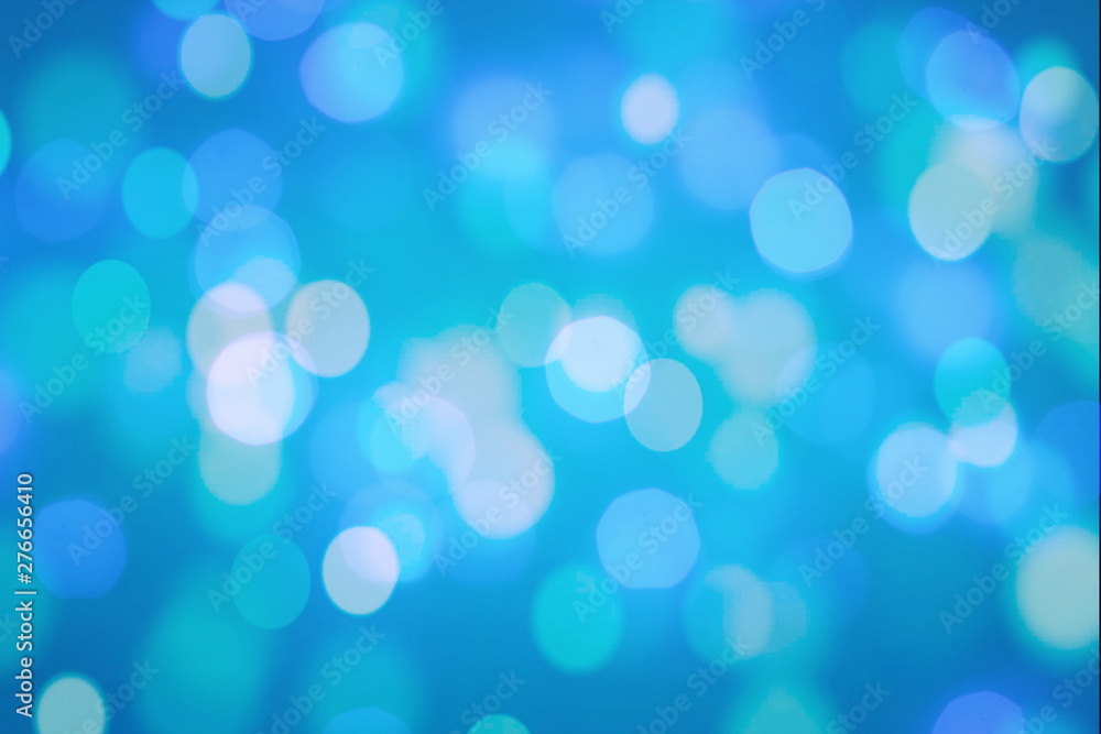 Fototapeta premium Winter elegant bokeh background. Seasonal cooling light decorative abstract design element.