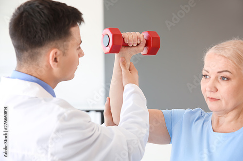 Physiotherapist working wit...