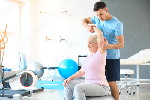 Physiotherapist working wit...
