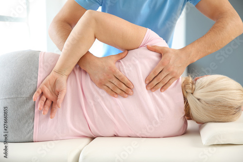 Physiotherapist working wit...