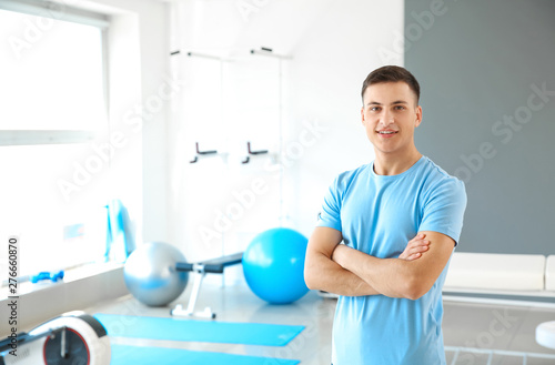 фотографія Young male physiotherapist in rehabilitation center