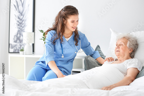 Medical worker with senior ...