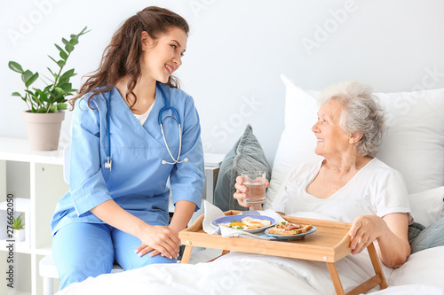 Young caregiver bringing se...