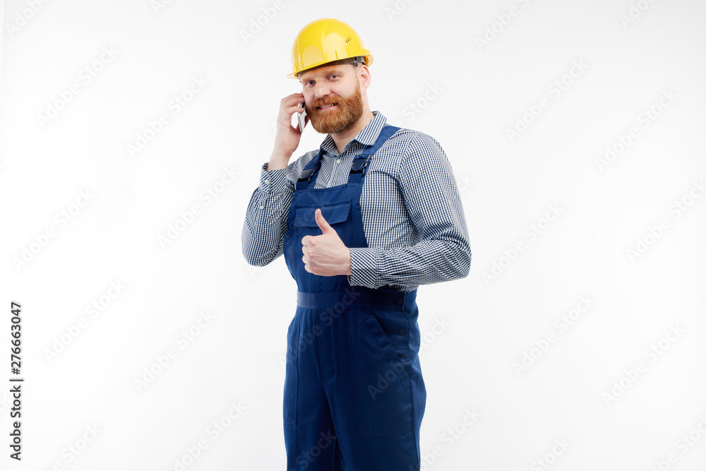 Engineer talking on the phone on a white background Engineer talking on the phone on a white background