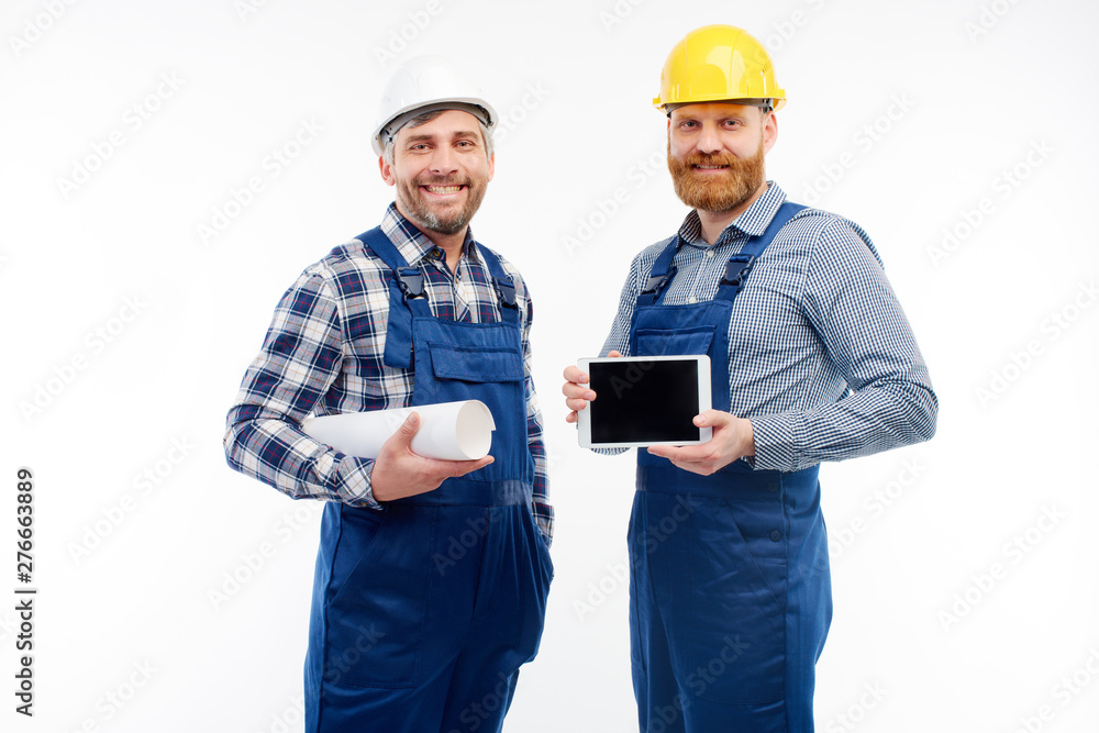 Two engineers smiling at camera on white background Two engineers smiling at camera on white background