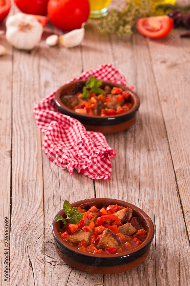 Marinated pork loin in tomato sauce. Marinated pork loin in tomato sauce.