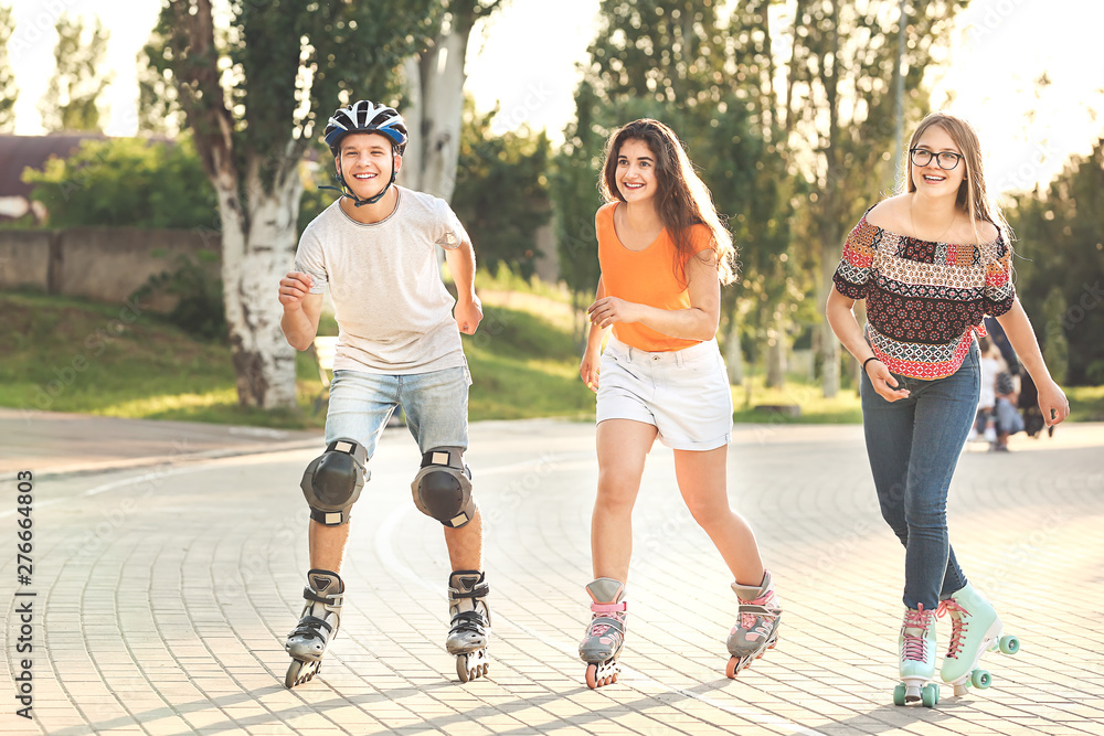 Teenagers on roller skates outdoors