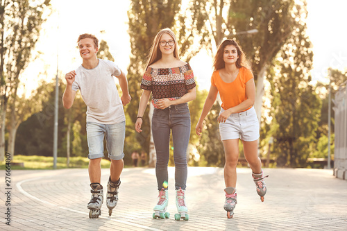 Teenagers on roller skates ...