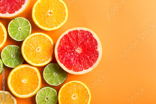 Fototapeta Naklejka Na Ścianę i Meble -  Many different citrus fruits on color background