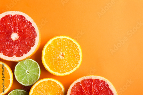 Fototapeta Naklejka Na Ścianę i Meble -  Many different citrus fruits on color background
