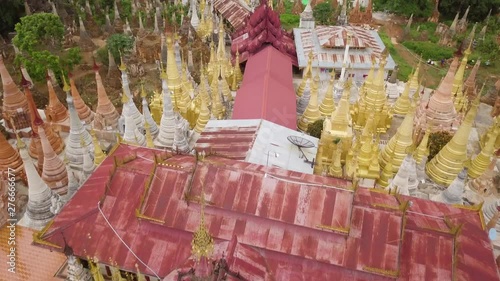 Aerial Flyby of the Inn Tain Pagoda at Inle Lake, Myanmar (Burma) Revealing the Landscape