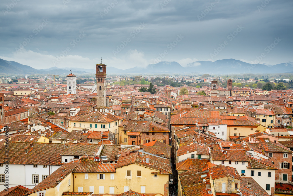 Lucca, Italy. Clock tower and San Michele basilica