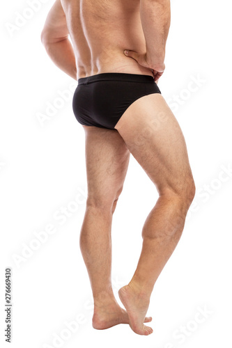 Naked adult man in shorts, side view. Isolated on a white background. Vertical.