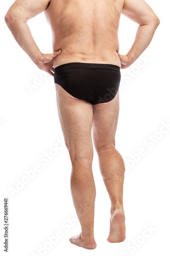 Adult fat man in black shorts, full-length, rear view. Isolated on a white background. Vertical.