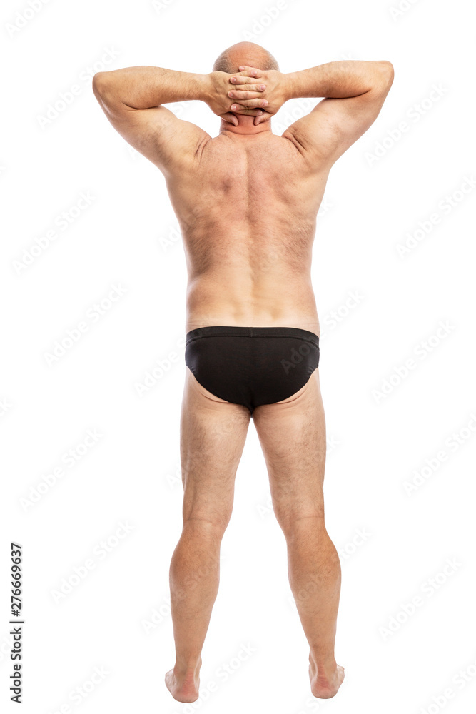 Adult fat man in black shorts, full-length, rear view. Isolated on a white background. Vertical. Adult fat man in black shorts, full-length, rear view. Isolated on a white background. Vertical.