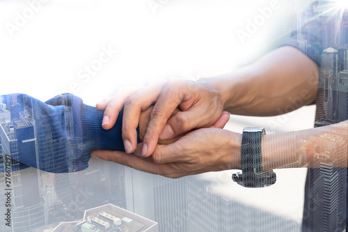 Double exposure of Businessman with client holding hands together for comfort and support work together, insurance team,respect and trust concept