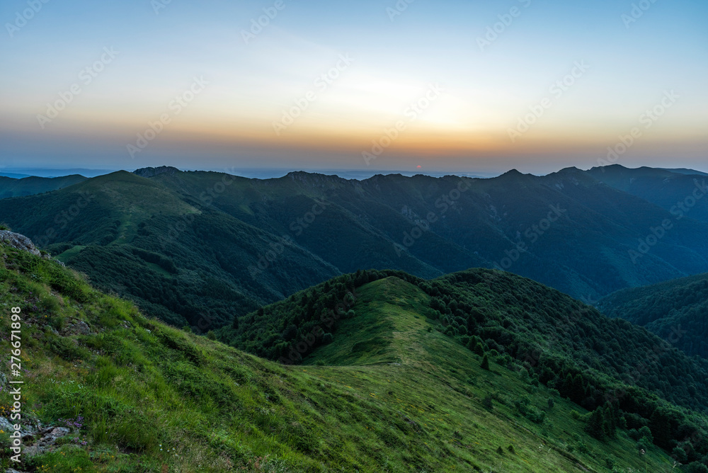 Mountain valley during sunrise. Natural summer landscape
