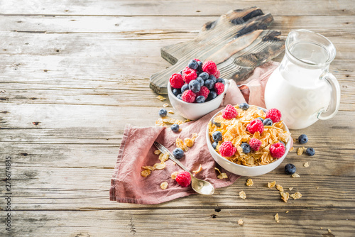 Healthy Corn Flakes for Breakfast with Milk and fresh summer berries