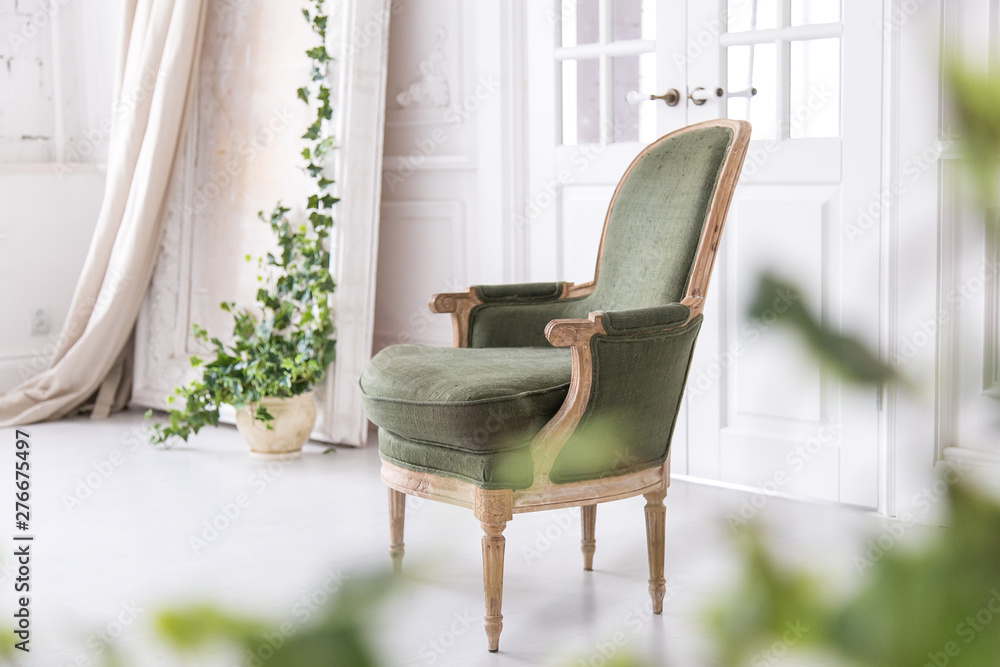 custom made wallpaper toronto digitalModern, bright interior with stucco mouldings walls and a vintage armchair made of solid wood. Soft focus.