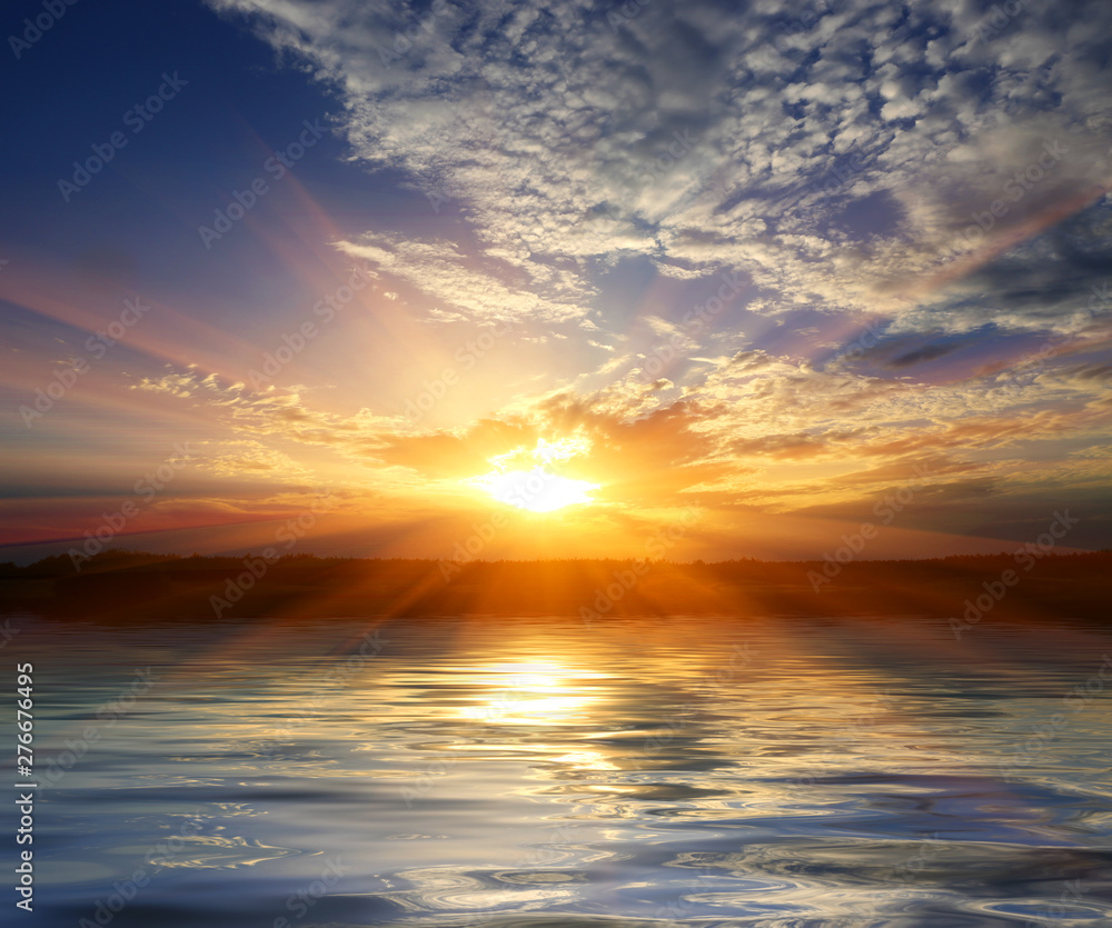 Obraz premium sunset over water