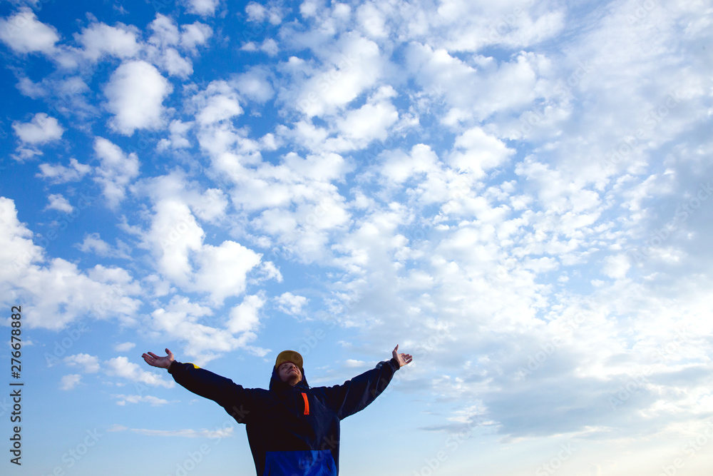 Happy man raised wide open arms traveling hiker blue sky and clouds healthy lifestyle adventure vacations outdoor success joyful emotions freedom Happy man raised wide open arms traveling hiker blue sky and clouds healthy lifestyle adventure vacations outdoor success joyful emotions freedom