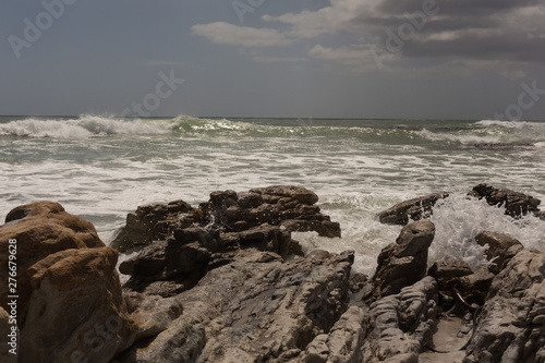 Sea waves splashing on the rock
