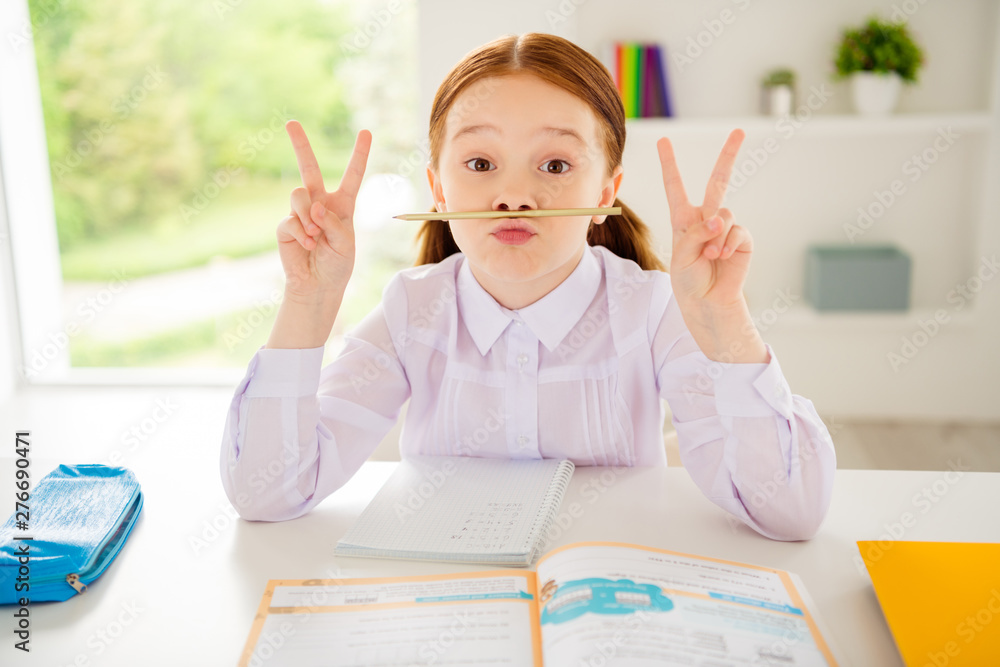 Portrait of funny little sweet child make v-signs have rest pause plsyfull sit class room wear white shirt blouse fashionable modern book foxy ginger haircut Portrait of funny little sweet child make v-signs have rest pause plsyfull sit class room wear white shirt blouse fashionable modern book foxy ginger haircut