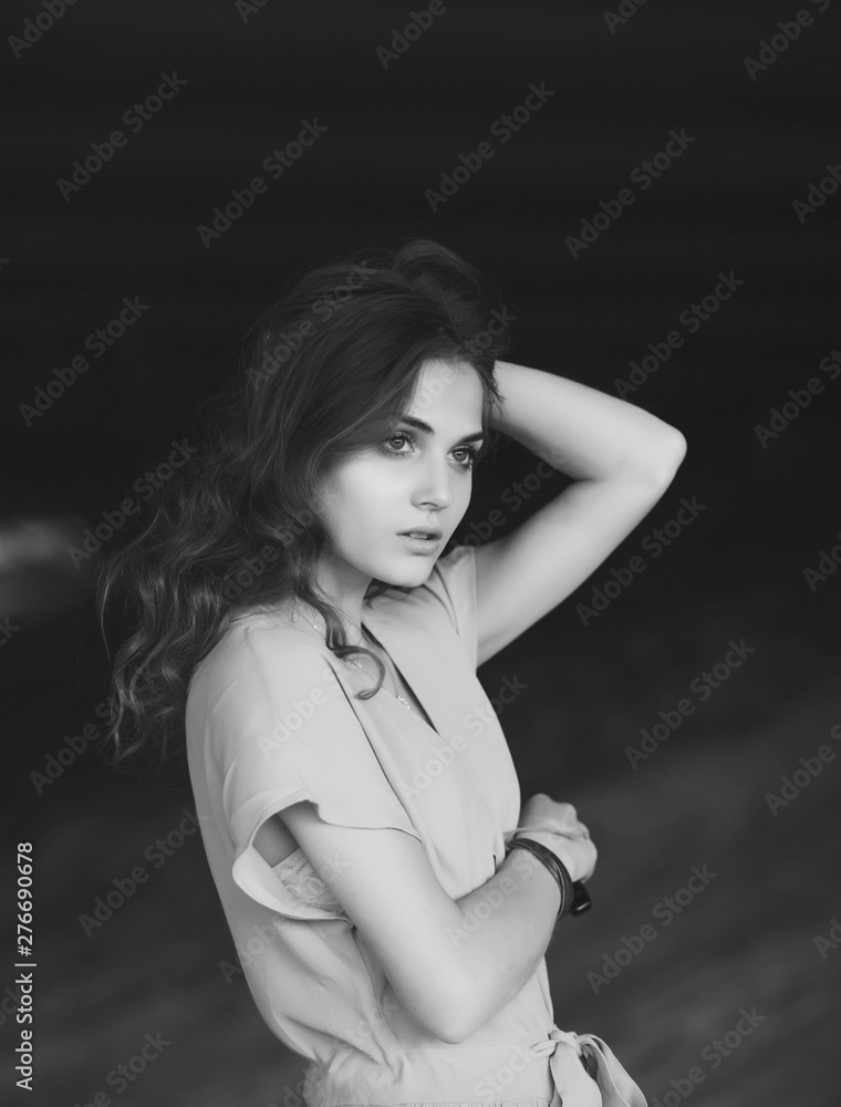 black and white portrait of a beautiful lonely girl with on a dark background black and white portrait of a beautiful lonely girl with on a dark background