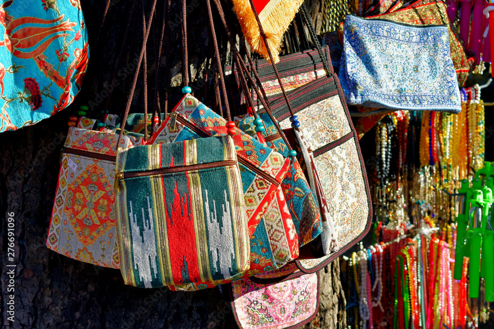 handbags made of fabric with traditional ornament in the oriental bazaar, Turkey