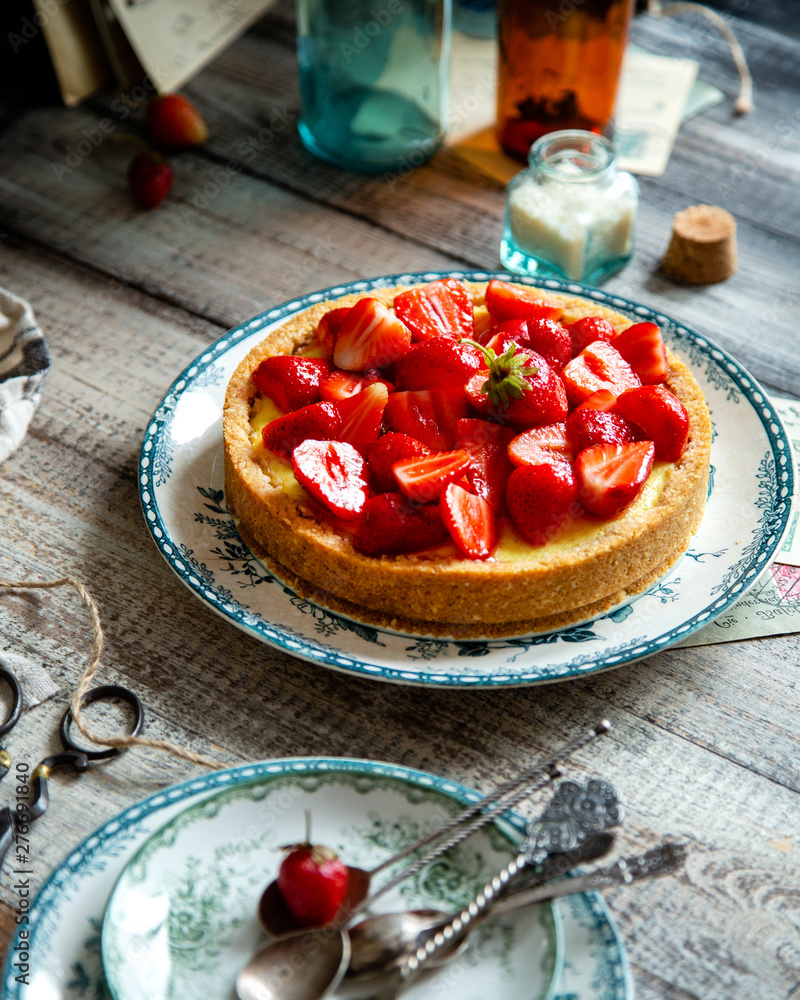 Homemade delicious strawberry tart or pie with sweet berries on top Homemade delicious strawberry tart or pie with sweet berries on top