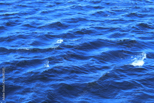 River waves, close-up. Blue color. Bright photography.