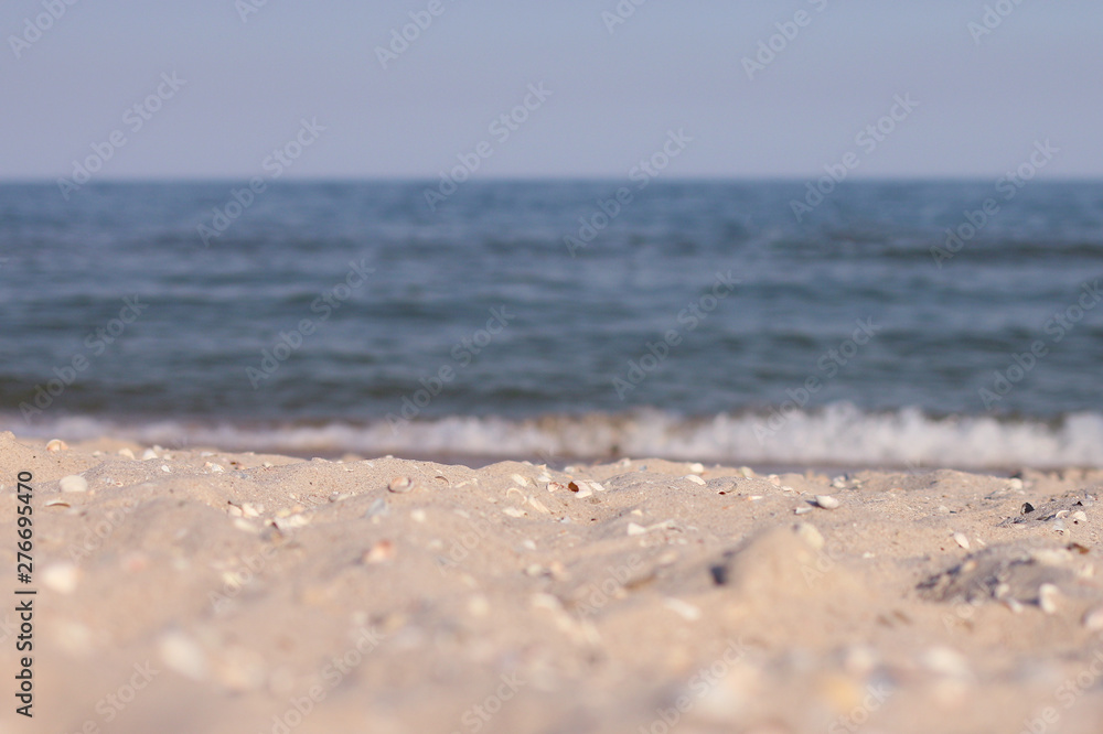 sandy beach by the sea against a blue sky sandy beach by the sea against a blue sky