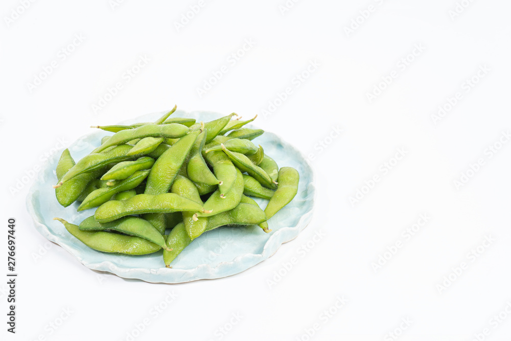 edamame beans in ceramic plate isolated on white background edamame beans in ceramic plate isolated on white background